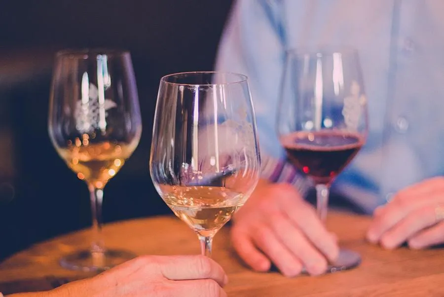 Glasses of wine on a barrel top