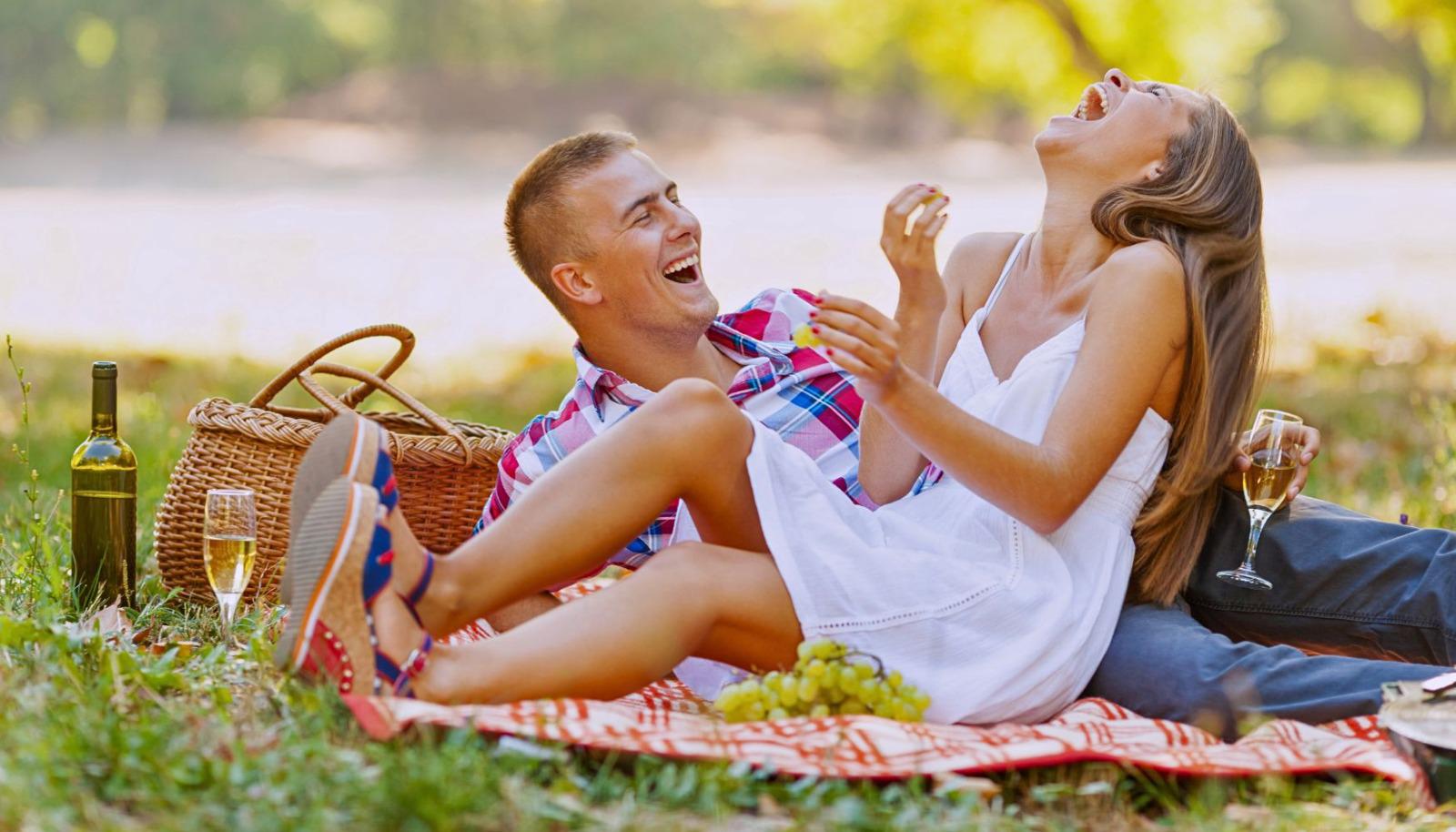 Couple enjoying a picnic at a winery  