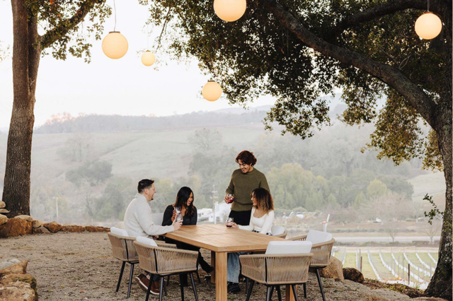 Friends at a Table Enjoying Wine on the Jade Vineyard & Winery property